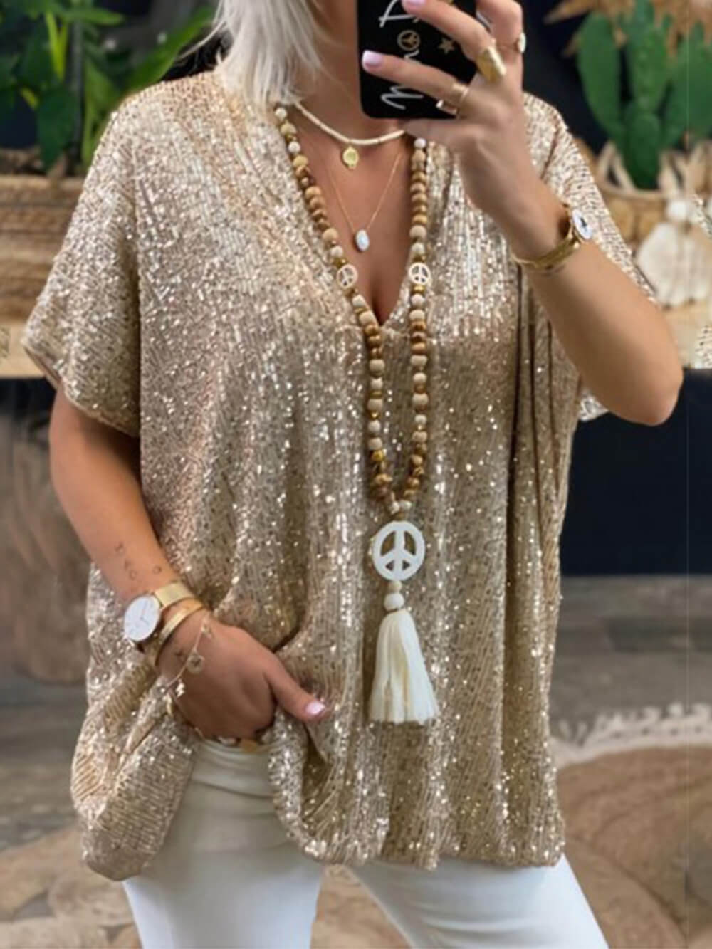 Bohemian loose pullover sequin v-neck top for women, sparkling sequins, and relaxed fit.