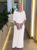 Women's 2-piece wide leg trousers and airy blouse set in a lightweight fabric, perfect for all-season style.