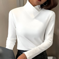 Woman wearing an asymmetric turtleneck office shirt, a stylish and modern work top.