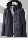 Camouflage outdoor jacket for women: Waterproof, removable hood, relaxed fit.