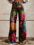Woman wearing abstract high-waisted tapered pants.