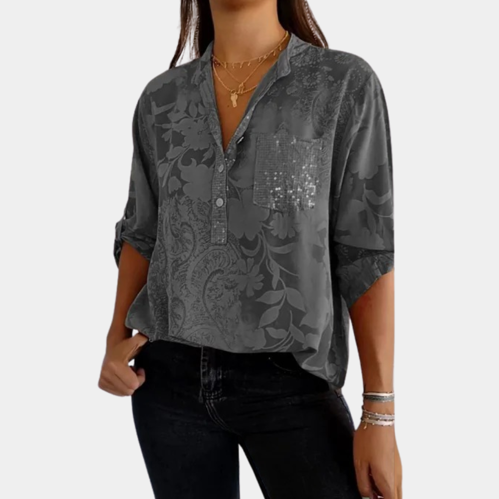 Woman wearing a purple adjustable long sleeve blouse, an elegant and versatile all-season top.