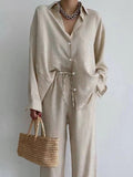 Blouse with Wide-Leg Pants: Flowy linen set for women. Breathable, sustainable all-season style. Elegant and comfortable outfit.