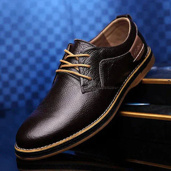Blue leather breathable lace-up shoes for men, perfect for spring and summer casual wear.