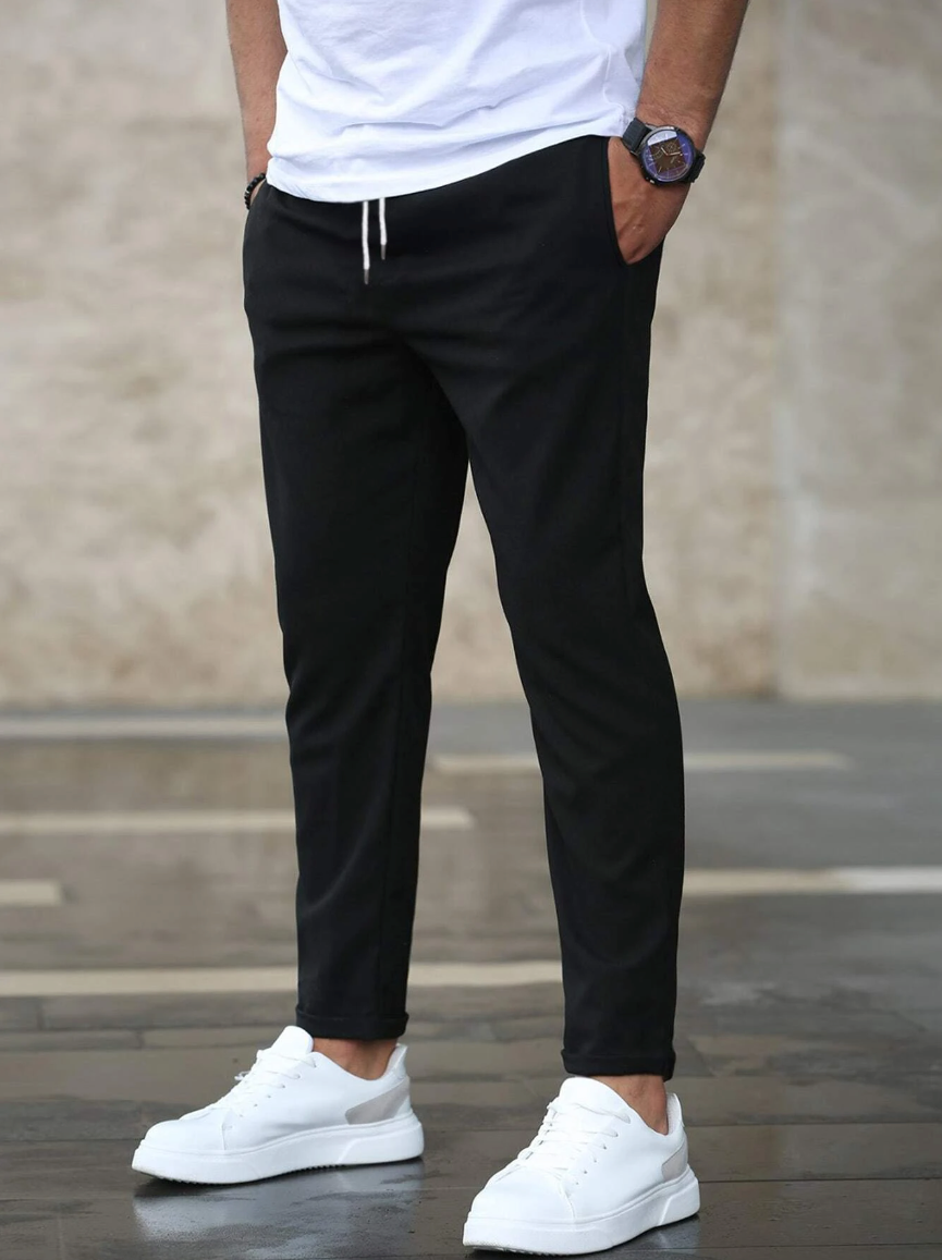 Men's casual drawstring trousers in a cotton blend with side pockets, perfect for everyday wear.