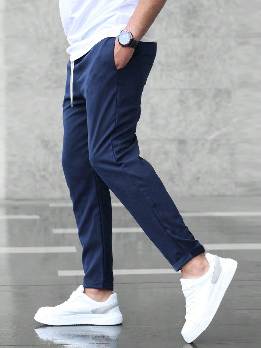 Men's casual drawstring trousers in a cotton blend with side pockets, perfect for everyday wear.