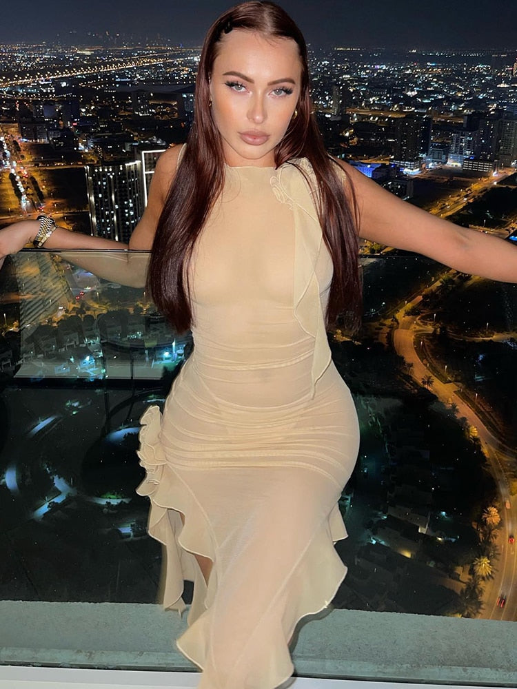 Elegant woman in an asymmetric ruffle evening dress, perfect for formal events and weddings.