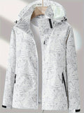 Women's camouflage outdoor jacket: Waterproof, removable hood, ideal for hiking and camping.