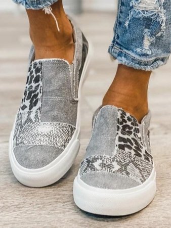 Animal print canvas slip-on shoes: casual, lightweight footwear with a stylish animal pattern and easy slip-on design.