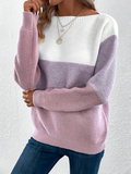 Woman wearing a khaki boat neck long sleeve knit sweater.