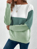 Woman wearing a boat neck long sleeve knit sweater in khaki.