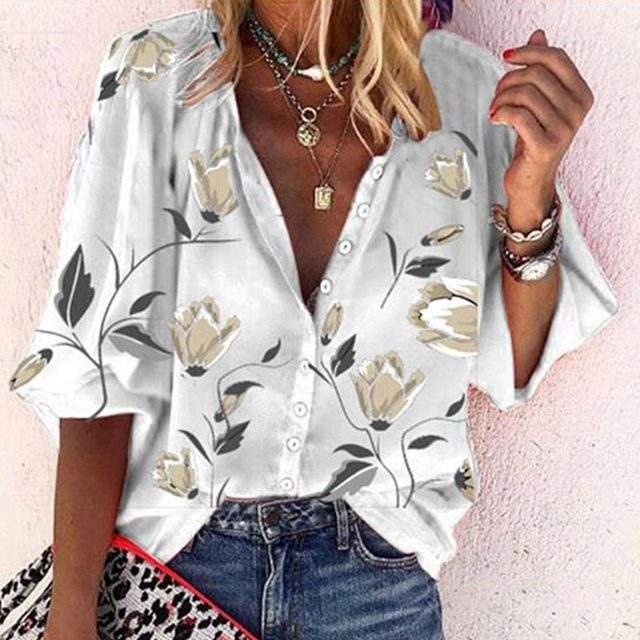 Woman wearing a 3D floral print long-sleeved top.